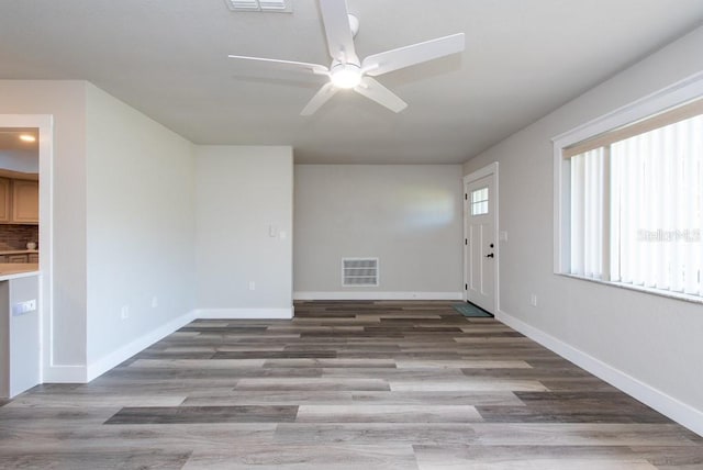 entryway with hardwood / wood-style flooring and ceiling fan