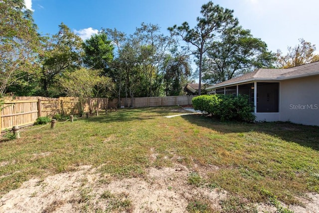 view of yard with a sunroom