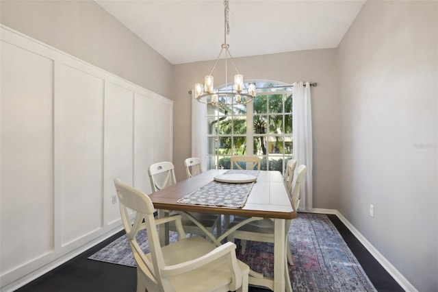 dining space with an inviting chandelier