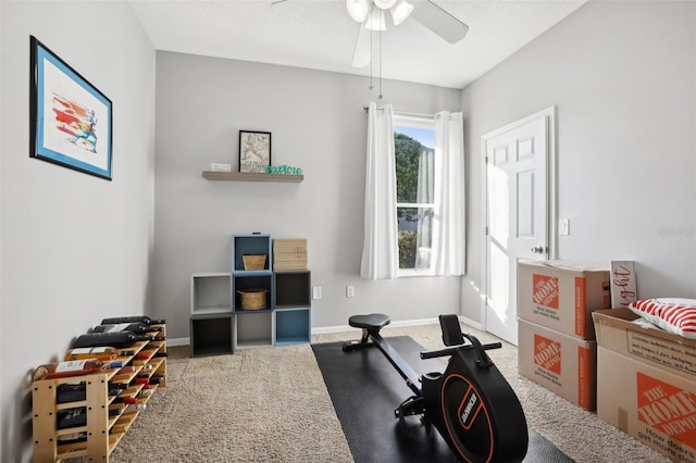 exercise area with carpet flooring and ceiling fan