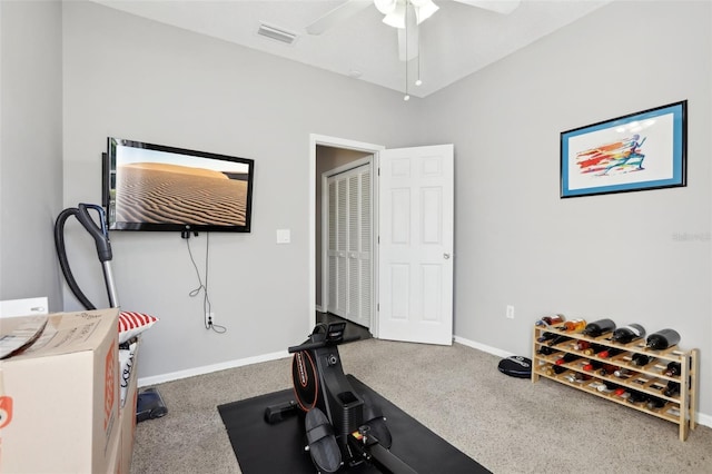 exercise room with carpet and ceiling fan