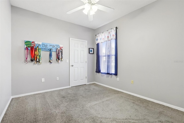 carpeted empty room with ceiling fan