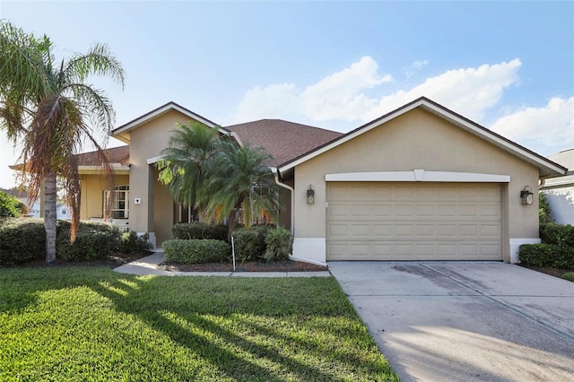 single story home featuring a front lawn and a garage