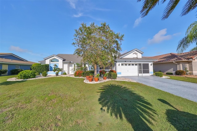 ranch-style house featuring a front lawn and a garage