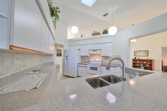 kitchen with white appliances, sink, pendant lighting, white cabinetry, and high vaulted ceiling