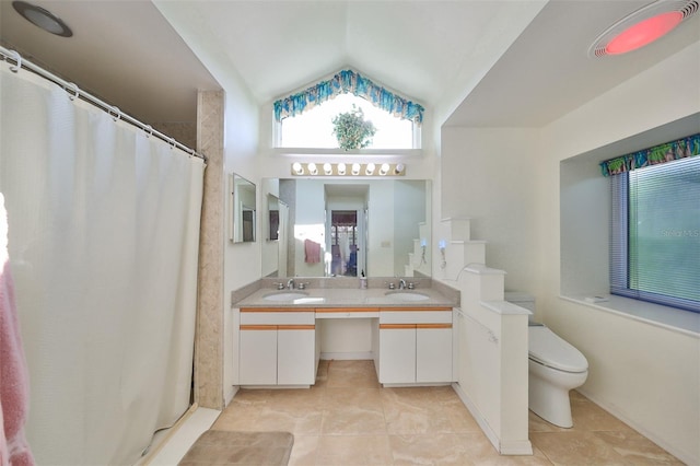 bathroom with toilet, tile patterned flooring, a shower with curtain, vaulted ceiling, and vanity