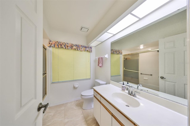 bathroom with a shower with door, toilet, tile patterned floors, and vanity