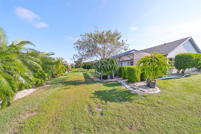 view of yard featuring a lanai