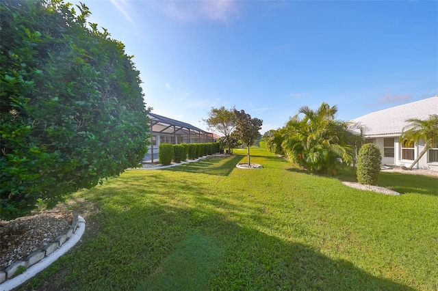 view of yard with a lanai