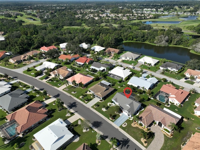 birds eye view of property with a water view