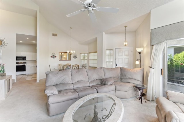 living room featuring light colored carpet, plenty of natural light, and high vaulted ceiling