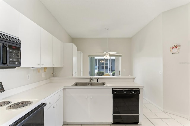 kitchen featuring black appliances, sink, and white cabinets