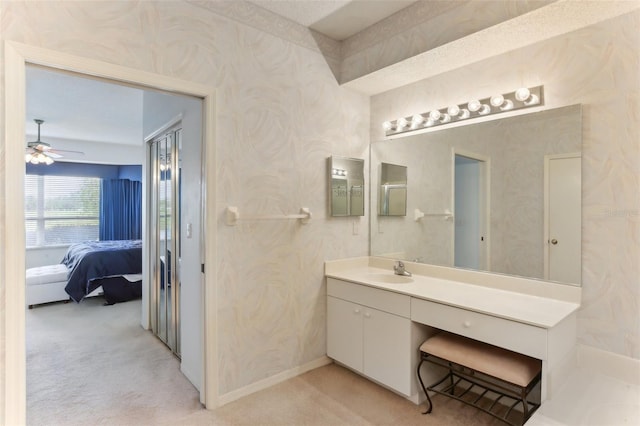 bathroom featuring ceiling fan and vanity