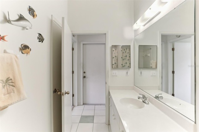 bathroom featuring tile patterned flooring and vanity