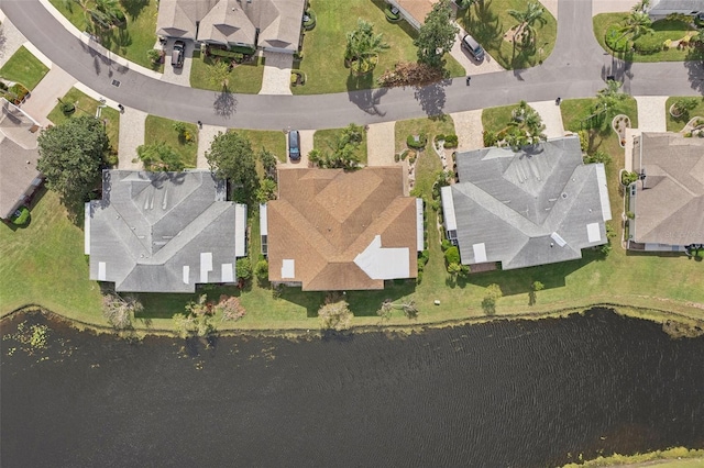 drone / aerial view with a water view