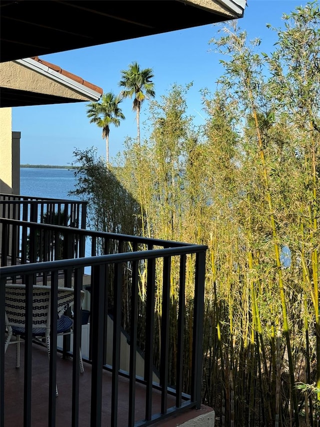 balcony featuring a water view