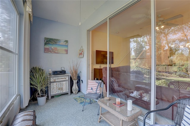 sunroom featuring ceiling fan