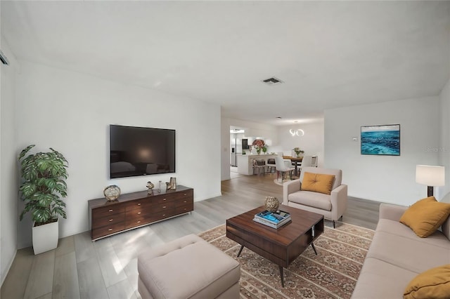 living room with light hardwood / wood-style floors