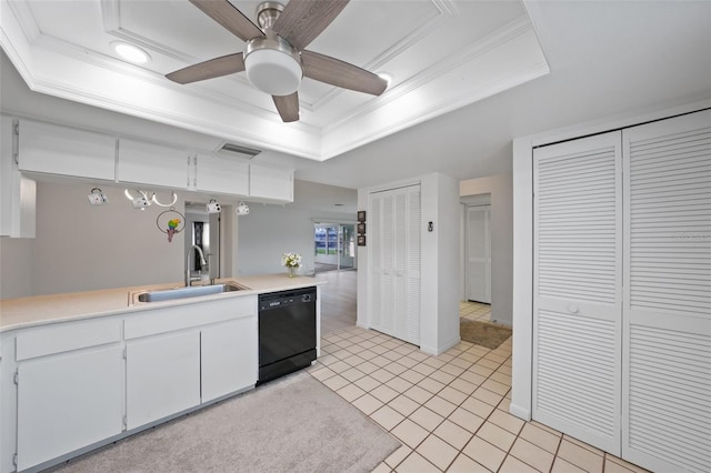 kitchen featuring white cabinets, black dishwasher, hanging light fixtures, light tile patterned floors, and sink