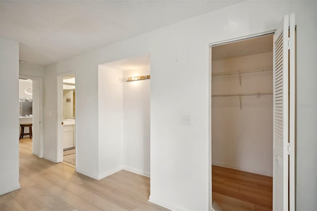 interior space featuring a closet and light wood-type flooring