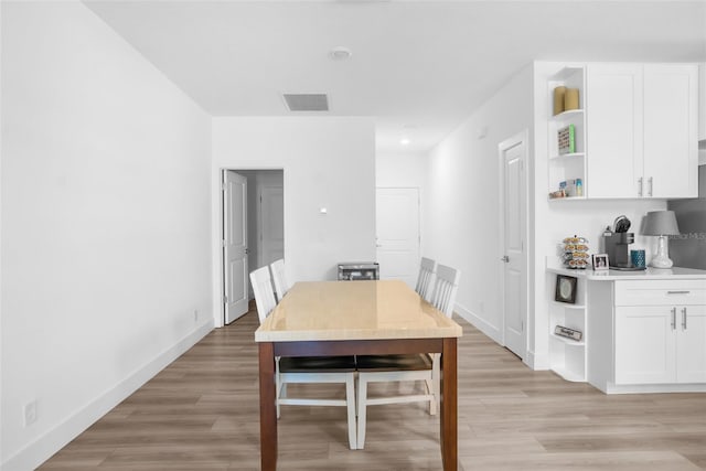 dining room with light wood-type flooring