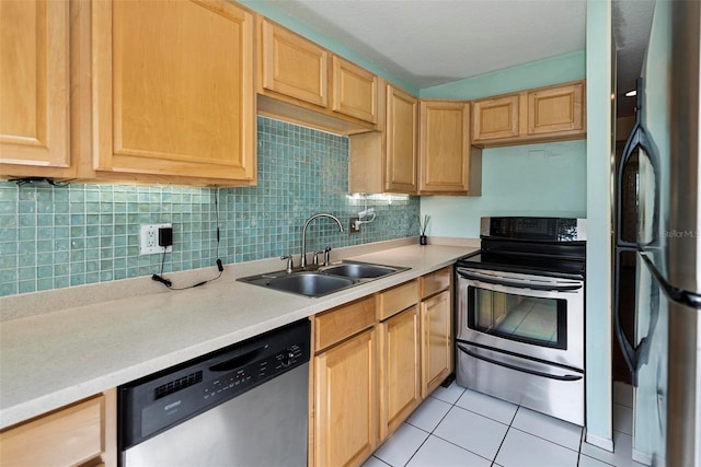 kitchen with stainless steel appliances, backsplash, light tile patterned floors, light brown cabinetry, and sink