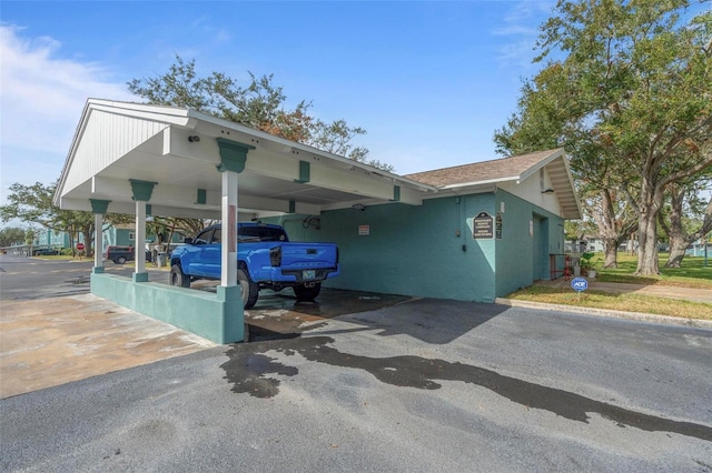 exterior space featuring a carport