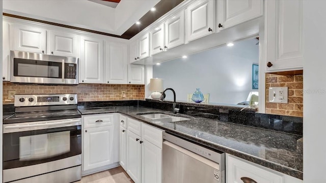 kitchen featuring white cabinetry and stainless steel appliances