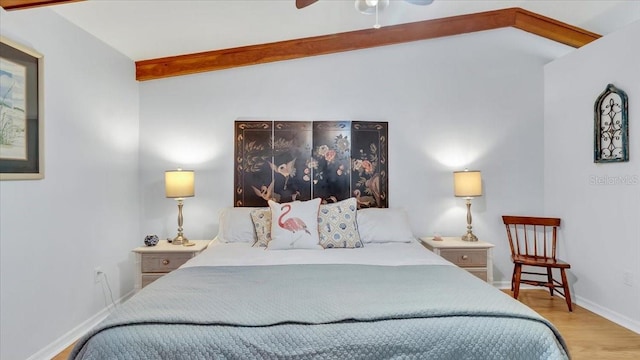 bedroom with vaulted ceiling with beams, ceiling fan, and light hardwood / wood-style flooring