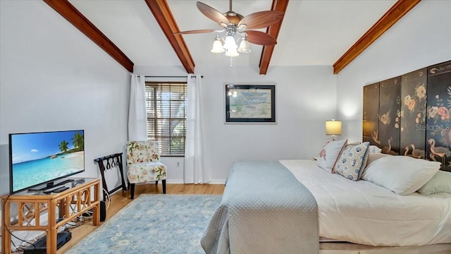 bedroom featuring ceiling fan, lofted ceiling with beams, and light wood-type flooring