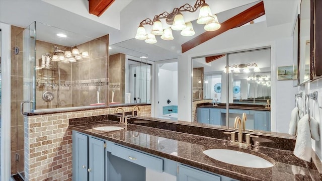 bathroom with vanity, lofted ceiling, and a shower with door