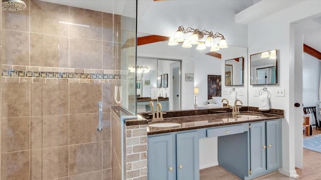 bathroom with vanity, wood-type flooring, and walk in shower