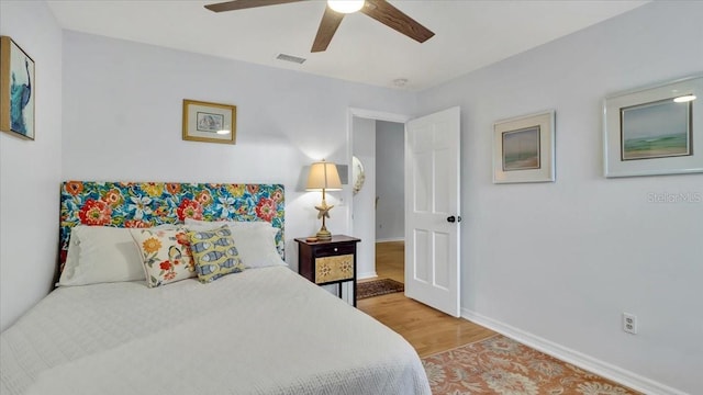 bedroom featuring ceiling fan and hardwood / wood-style floors