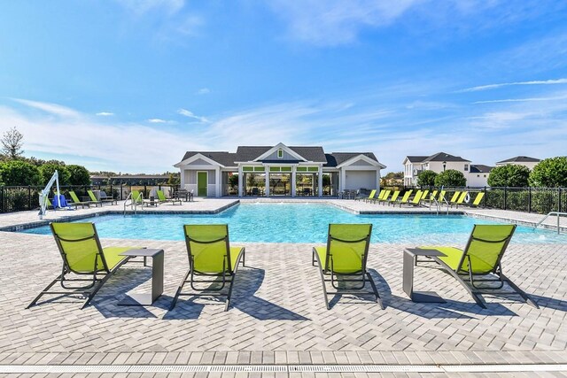 view of swimming pool featuring a patio