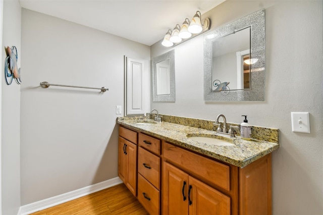 bathroom featuring hardwood / wood-style flooring and vanity