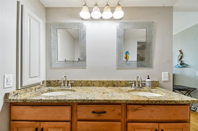 bathroom featuring vanity and wood-type flooring