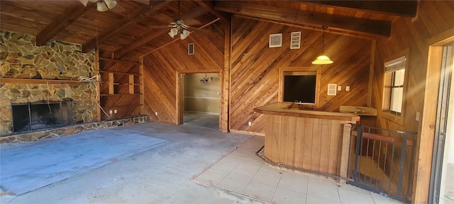 unfurnished living room featuring ceiling fan, high vaulted ceiling, beamed ceiling, and wood ceiling