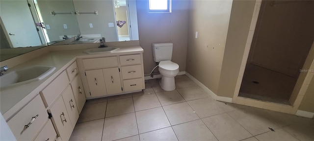 bathroom with toilet, vanity, a shower, and tile patterned flooring