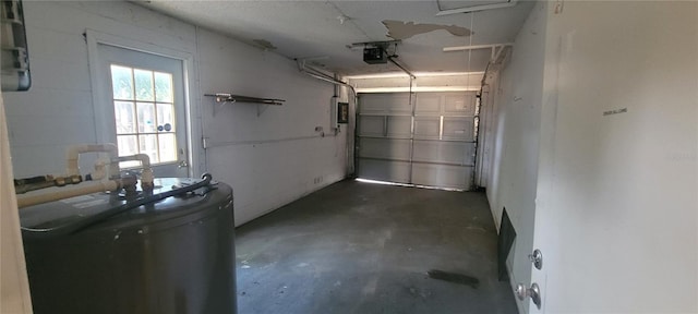 garage featuring a garage door opener and water heater