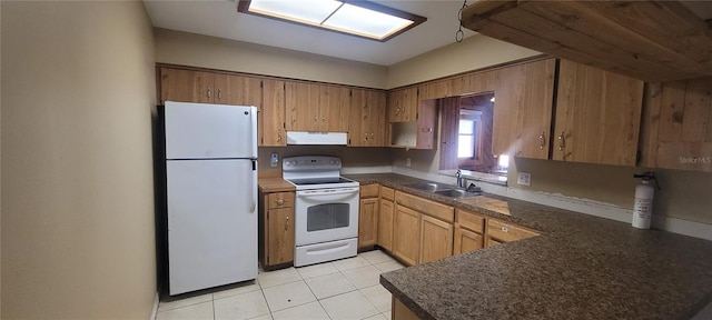 kitchen with kitchen peninsula, light tile patterned floors, sink, ventilation hood, and white appliances