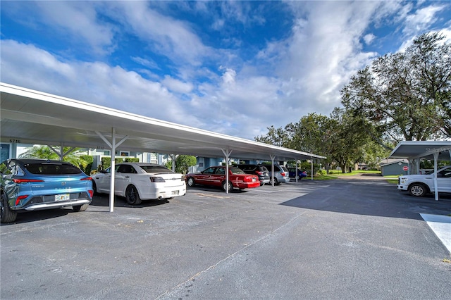 view of parking / parking lot with a carport