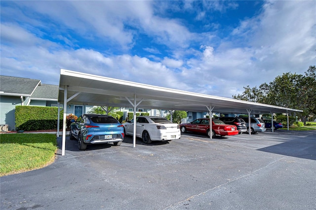 view of parking / parking lot with a carport