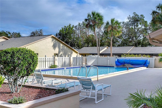 view of swimming pool featuring a patio area