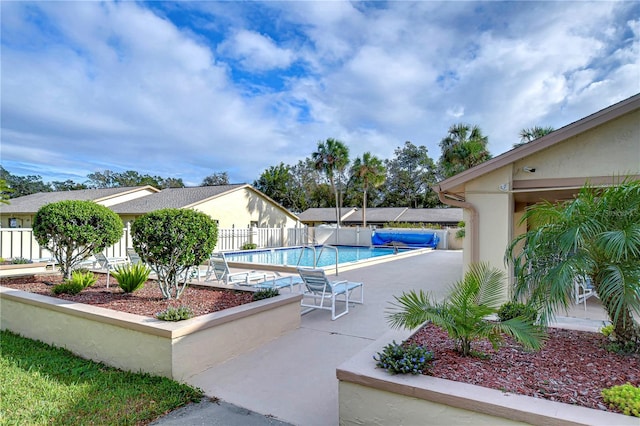 view of swimming pool with a patio area