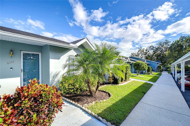 view of property exterior with a lawn