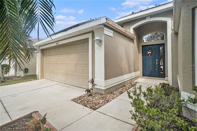 doorway to property featuring a garage