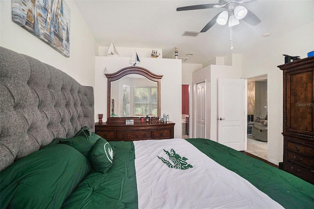 bedroom with ceiling fan and a closet