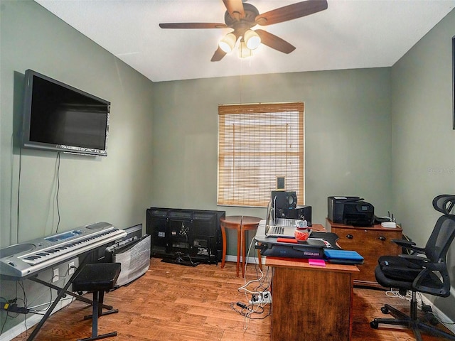 office with ceiling fan and light hardwood / wood-style floors