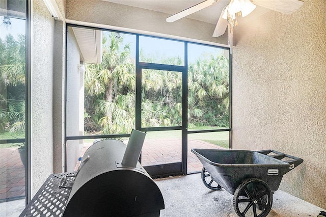 sunroom / solarium with ceiling fan