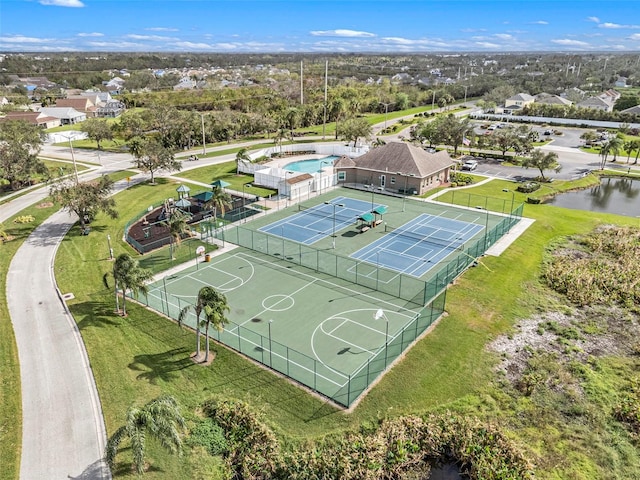 birds eye view of property with a water view